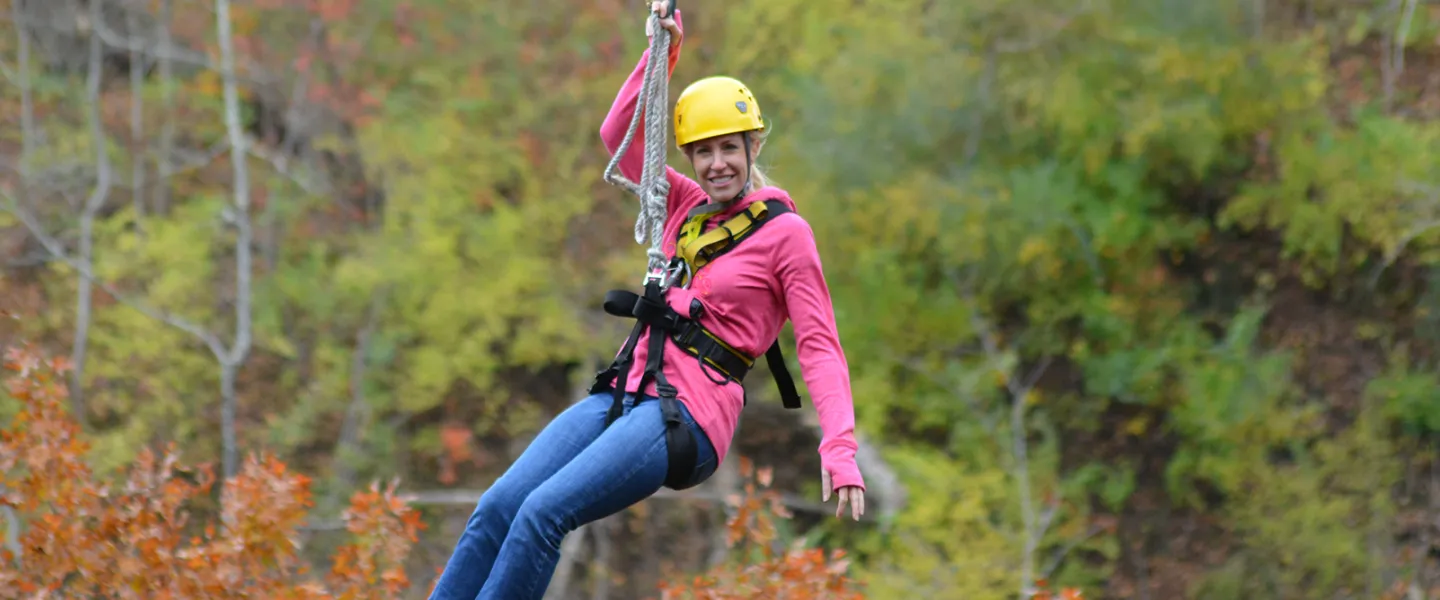 A woman zipping in the autumn